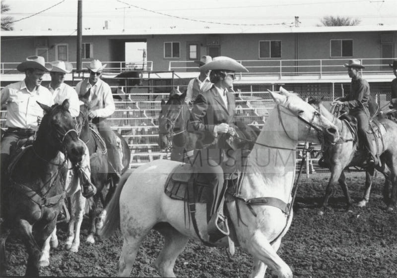 Five Men and One Woman on Horseback on Parade