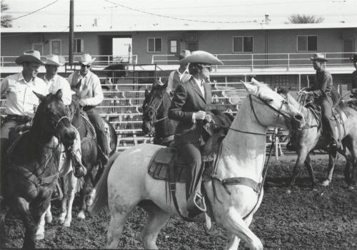 Five Men and One Woman on Horseback on Parade