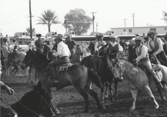 Competitors Riding in a Parade at a Rodeo
