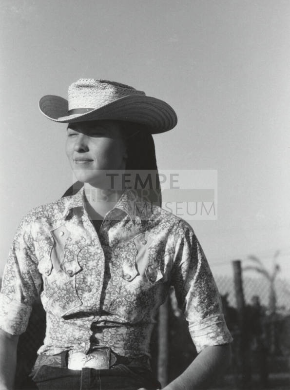 Spectator in Western Garb at the Rodeo