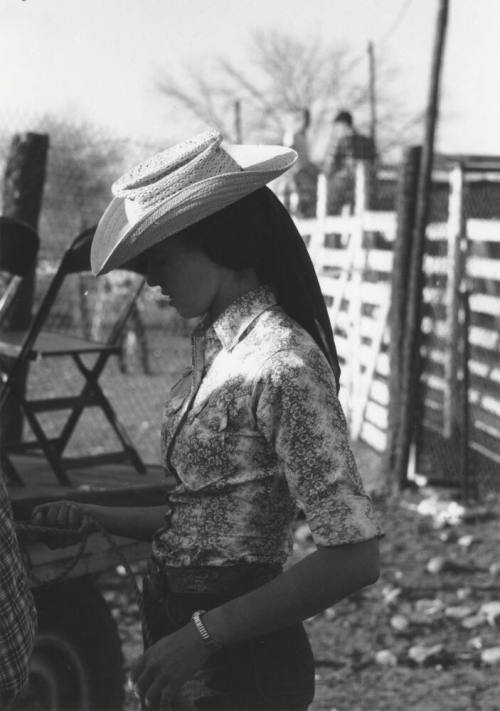 Lady Spectator Behind the Stands at the Rodeo