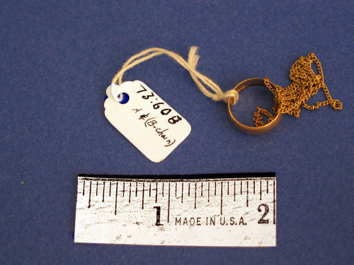Small ring on gold link chain