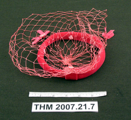 Pink hat with veil.