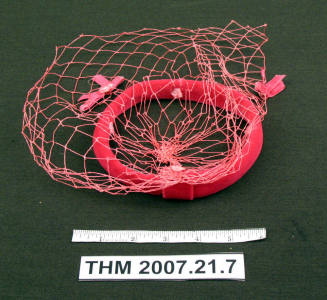 Pink hat with veil.