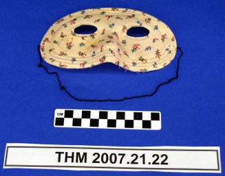 Pink flowered half mask.