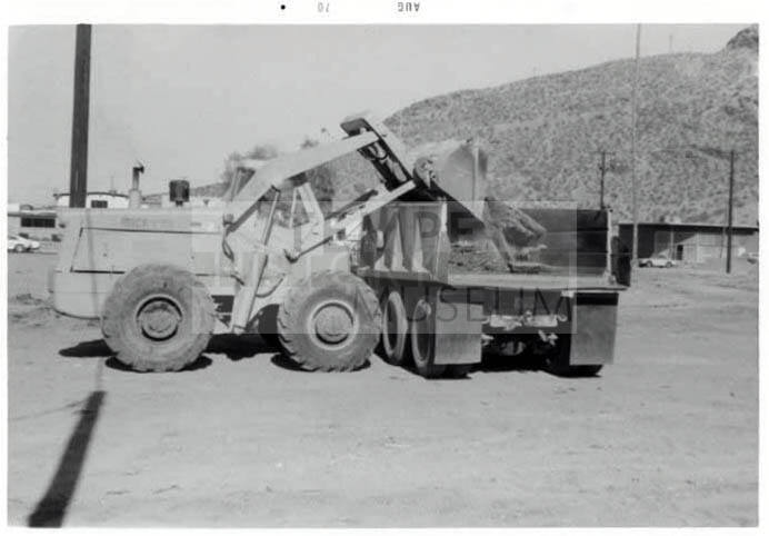 Photograph: Cleaning Debris from Construction area, Tempe City Hall Site, by Luis Chacon