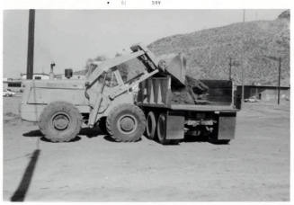 Photograph: Cleaning Debris from Construction area, Tempe City Hall Site, by Luis Chacon