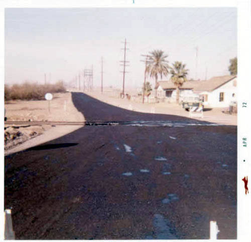 Photograph: Oiling Dorsey Lane between University and old 8th St., by Luis Chacon