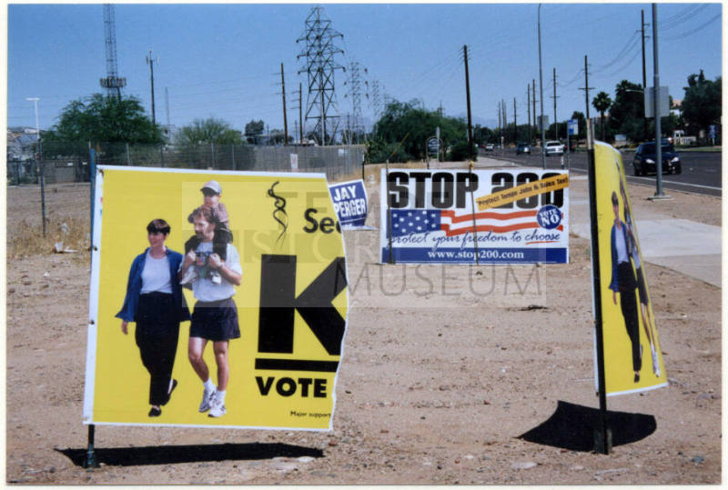 Torn Proposition 200 Sign on University Drive in Tempe.