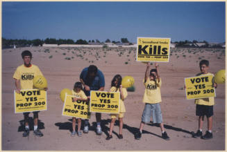 Rocha Family Holding Proposition 200 Signs.