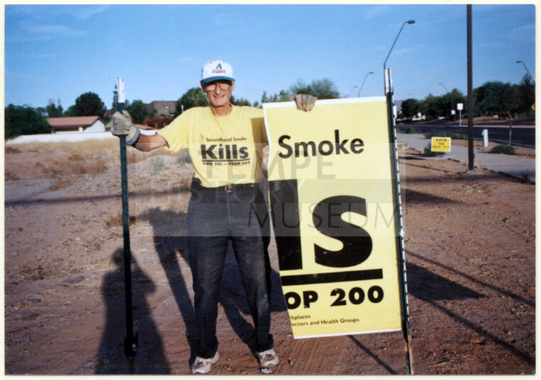 Leland Fairbanks with Vandalized Proposition 200 Sign.