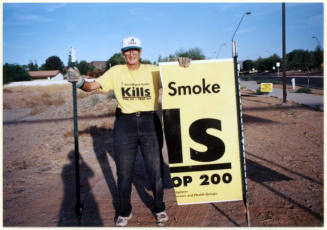 Leland Fairbanks with Vandalized Proposition 200 Sign.