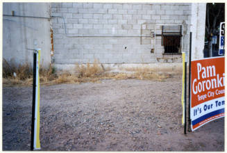 Poles Left Behind After a Propostion 200 Sign Was Cut Down.