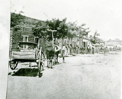 OS-7   Wagons in Front of Hayden House