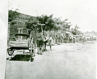 OS-7   Wagons in Front of Hayden House