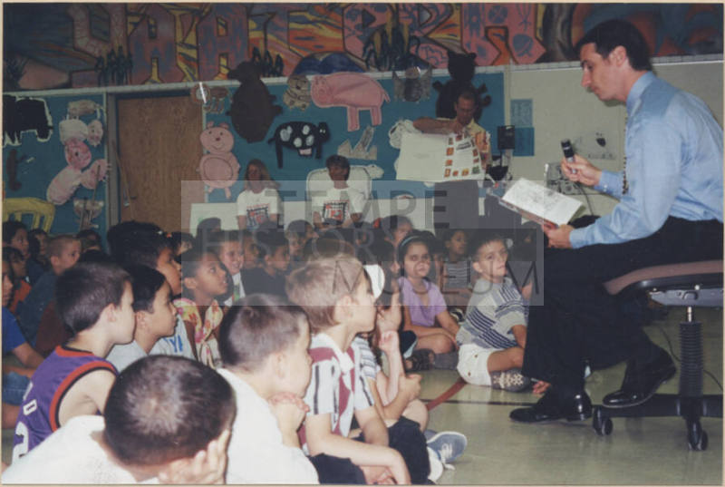 Neil Giuliano Reading to a Group of Children.