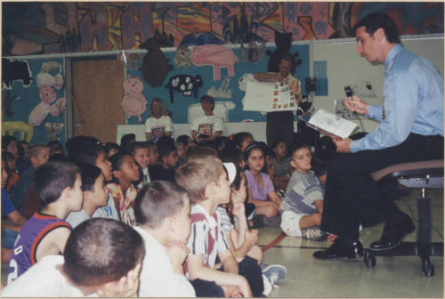 Neil Giuliano Reading to a Group of Children.