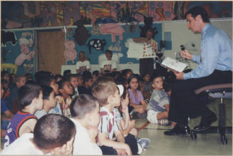 Neil Giuliano Reading to a Group of Children.