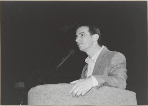 Black and White Photo of Neil Giuliano Speaking at a Podium.