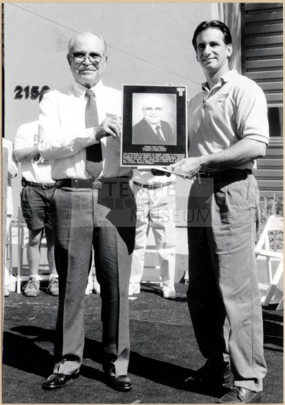 Black and White Photo of Neil Giuliano Presenting Plaque to Robert Franco Dedicating New Gymnasium in His Name.