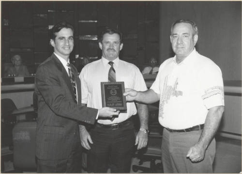 Neil Giuliano Receiving a Plaque Acknowledging Tempe Fleet Services for Reducing Pollution.