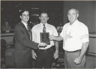 Neil Giuliano Receiving a Plaque Acknowledging Tempe Fleet Services for Reducing Pollution.