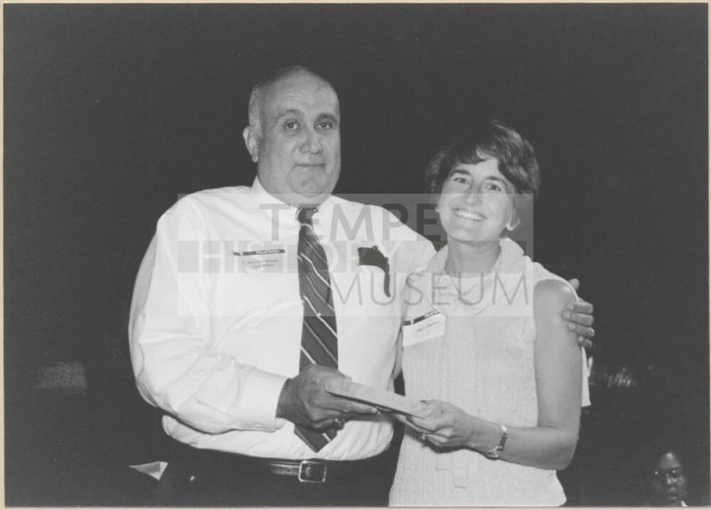 Black and White Photo of Vice Mayor Ben Arredondo Presenting Award to Mary Baroni.