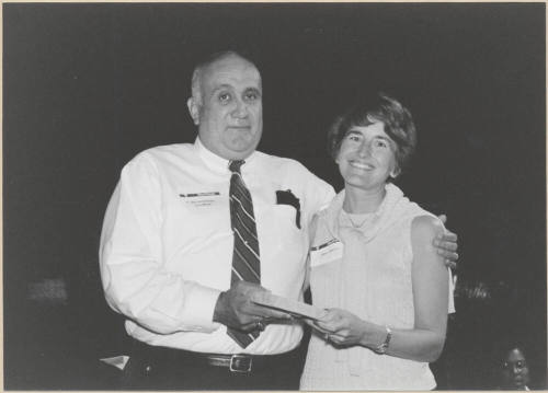 Black and White Photo of Vice Mayor Ben Arredondo Presenting Award to Mary Baroni.