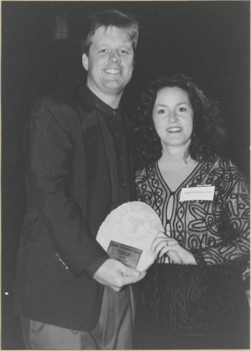 Photo of Councilman Joseph Lewis Presenting Plaque to Robin Trick.