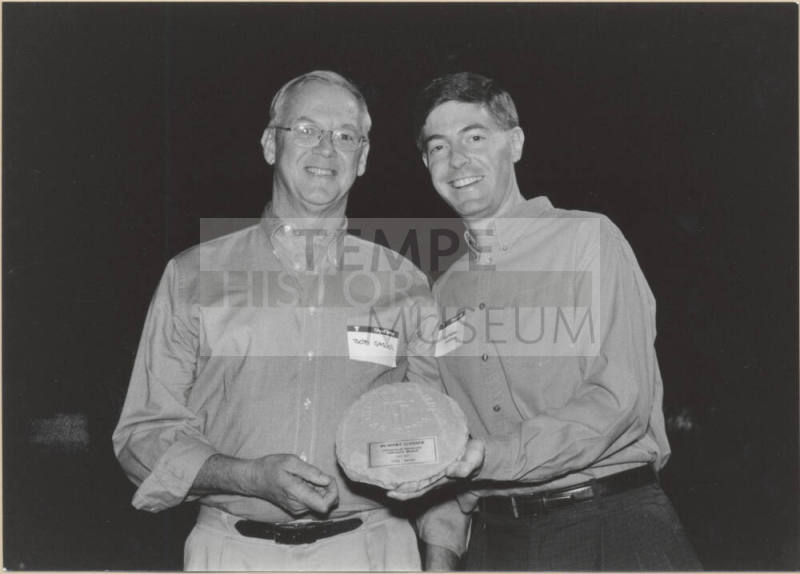 Photo of Hugh Hallman Presenting Plaque to Bob Gasser, 1999.