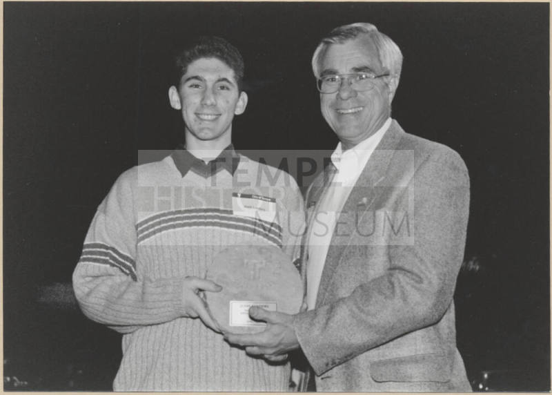 Photo of Leonard Copple Presenting Plaque to Josh Landers, 1999.