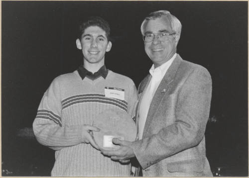 Photo of Leonard Copple Presenting Plaque to Josh Landers, 1999.