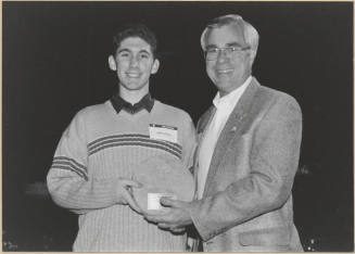 Photo of Leonard Copple Presenting Plaque to Josh Landers, 1999.