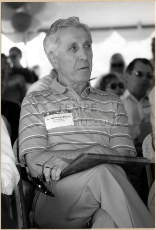 Photo of Dr. William LoPiano Holding Plaque.