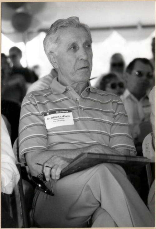 Photo of Dr. William LoPiano Holding Plaque.