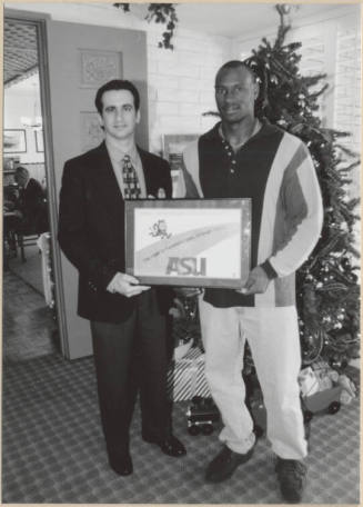 Neil Giuliano Presents Rose Bowl Plaque to Unnamed Man, 1997.
