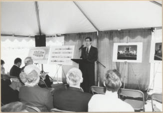 Neil Giuliano Speaks Next to Layout and Elevations for Arizona Mills Mall.