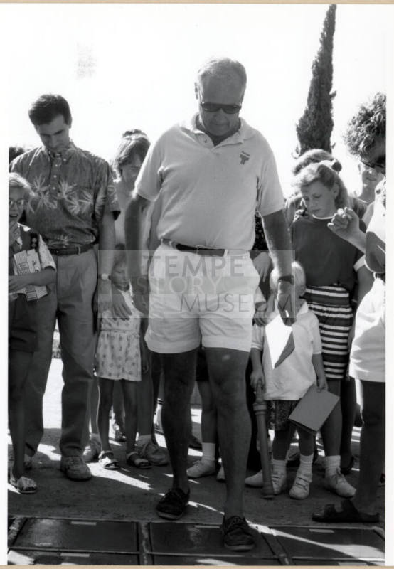 Councilman Frank Plencner Making a Cement Footprint During the Grand Opening of the Tempe Historical Museum, Oct. 1991.