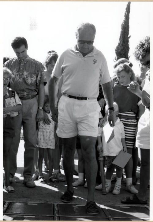 Councilman Frank Plencner Making a Cement Footprint During the Grand Opening of the Tempe Historical Museum, Oct. 1991.