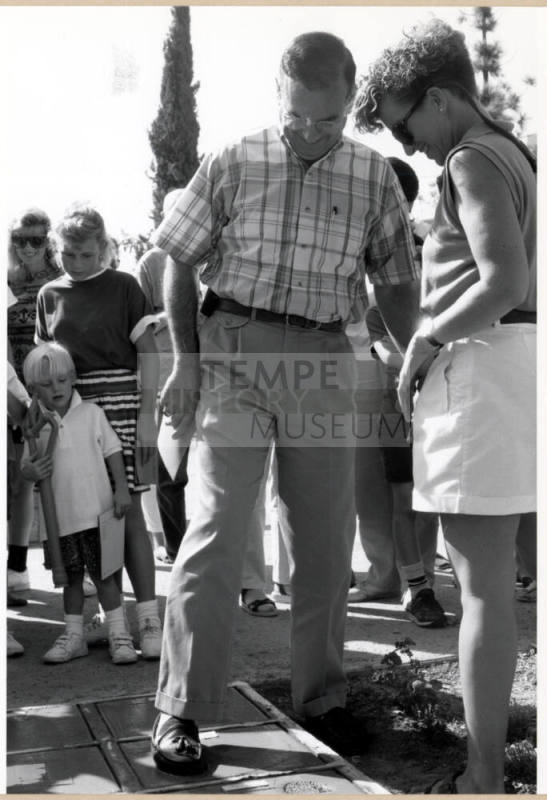 Councilman Don Cassano Making a Cement Footprint During the Grand Opening of the Tempe Historical Museum, Oct. 1991.