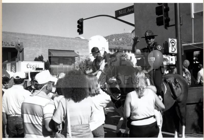 Mounted Police Officers and Crowd at Mill Ave. and 5th St.