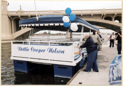 Photo of christening of the Dottie Cooper Nelson boat on Tempe Town Lake.