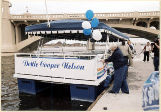 Photo of christening of the Dottie Cooper Nelson boat on Tempe Town Lake.