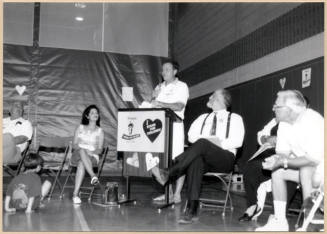 Photo of Stand for Children event with speaker and councilmen.