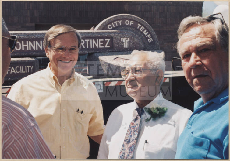Photo of water treatment plant dedication to Johnny Martinez in which he stands with two men.  The man to his right is Harry Mitchell.