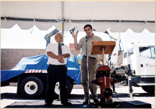 Color photograph of water treatment plant dedication with Johnny Matinez and Mayor Niel Giuliano at the Podium