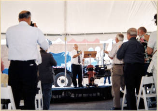Color photograph of water treatment plant dedication with Johnny Martinez speaking.