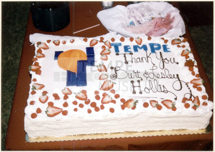 Color photograph of cake at the dedication of Hollis Family Park.