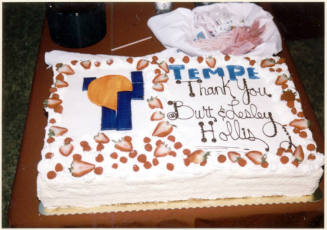 Color photograph of cake at the dedication of Hollis Family Park.