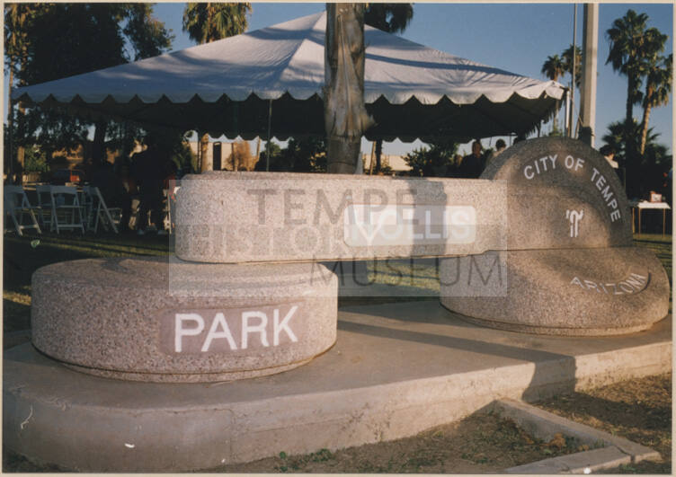 Color photograph of Hollis Park sign and recption tent for renaming of park.